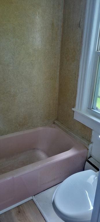 1 Barber Ave, Greenfield, MA 01301 - bathroom with a tub, wood finished floors, and toilet