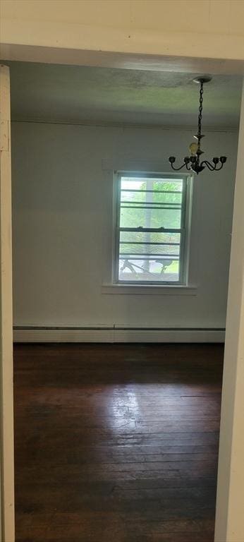 1 Barber Ave, Greenfield, MA 01301 - empty room featuring a chandelier, dark wood-type flooring, and baseboard heating