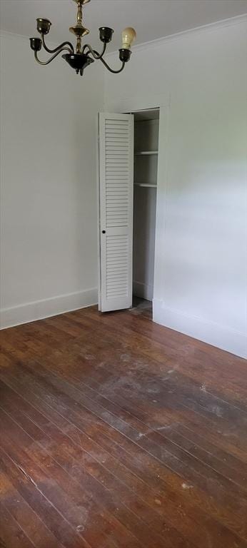 1 Barber Ave, Greenfield, MA 01301 - unfurnished dining area with wood-type flooring, a chandelier, crown molding, and baseboards