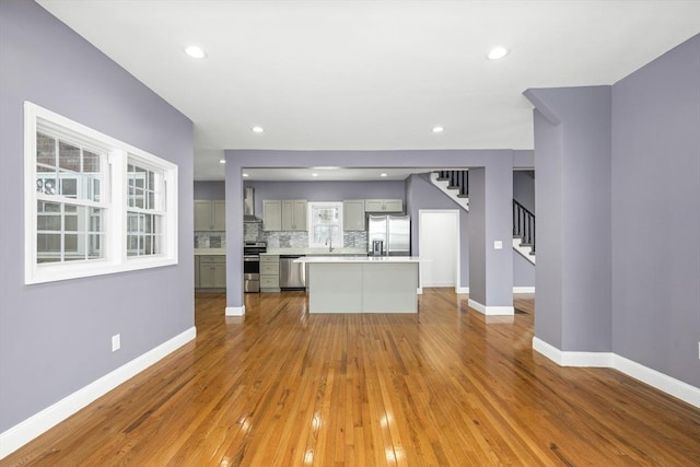 unfurnished living room featuring light wood-type flooring