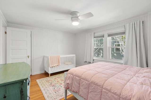 bedroom with wood finished floors and ceiling fan