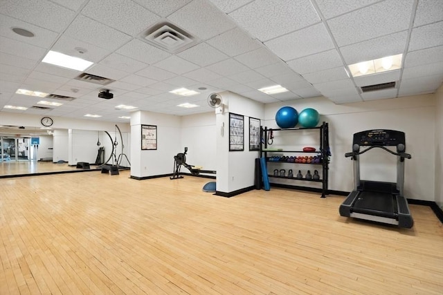 44 Washington St Unit 1208, Brookline, MA 02445 - gym featuring wood finished floors, a drop ceiling, and baseboards
