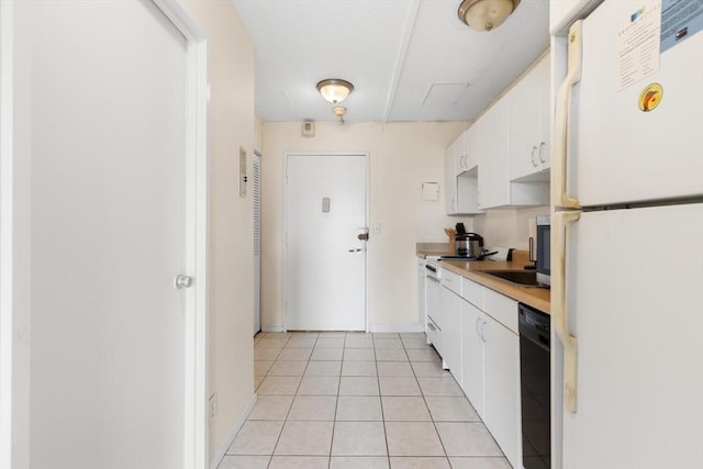 44 Washington St Unit 1208, Brookline, MA 02445 - kitchen with freestanding refrigerator, white cabinets, light countertops, dishwasher, and a sink