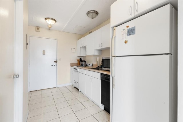 44 Washington St Unit 1208, Brookline, MA 02445 - kitchen featuring white appliances, white cabinetry, light countertops, and light tile patterned floors