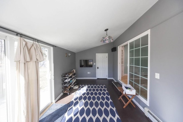 interior space with baseboards, baseboard heating, and vaulted ceiling