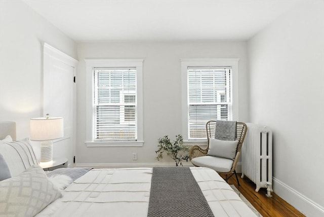 88 Brush Hill Rd, Milton, MA 02186 - bedroom featuring radiator and wood finished floors