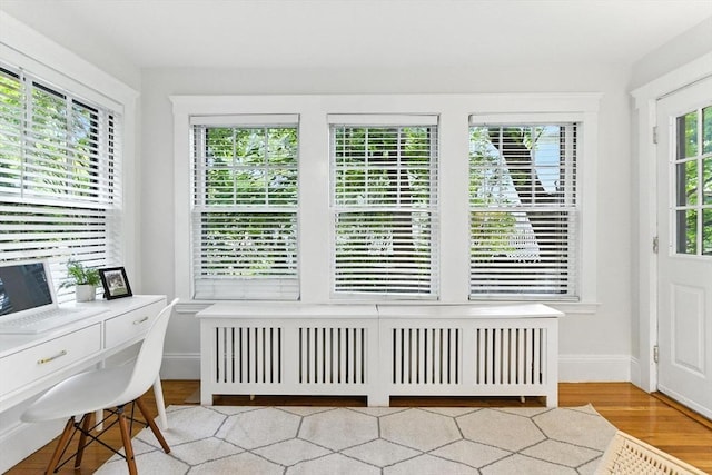 88 Brush Hill Rd, Milton, MA 02186 - home office with radiator heating unit and wood finished floors