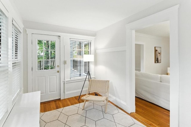 88 Brush Hill Rd, Milton, MA 02186 - doorway to outside featuring wood finished floors and ornamental molding