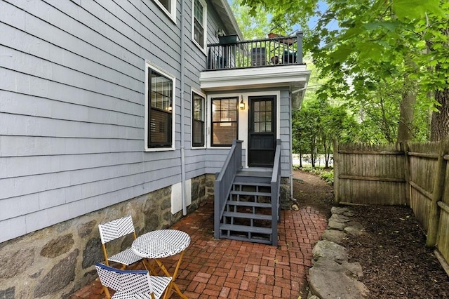 88 Brush Hill Rd, Milton, MA 02186 - doorway to property featuring a balcony and a patio area