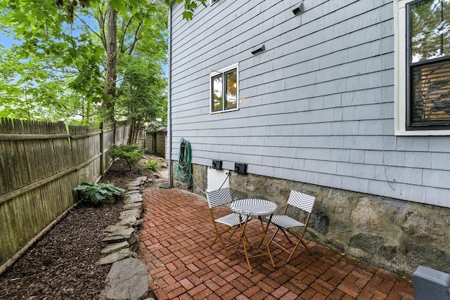 88 Brush Hill Rd, Milton, MA 02186 - fenced backyard featuring a patio