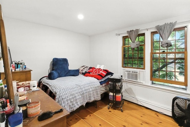 88 Brush Hill Rd, Milton, MA 02186 - bedroom featuring baseboard heating, hardwood / wood-style flooring, cooling unit, and recessed lighting