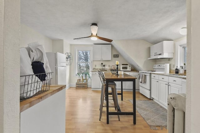 kitchen with ceiling fan, white cabinets, white appliances, and light wood-type flooring