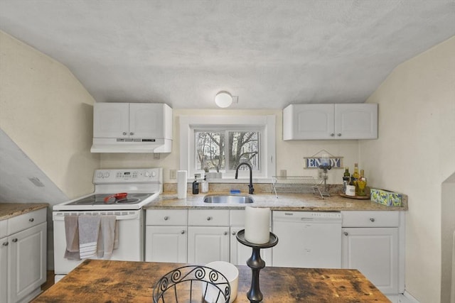 kitchen with white appliances, white cabinetry, sink, and vaulted ceiling