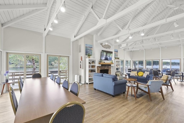 225 SW Mdws Unit 225, Falmouth, MA 02536 - dining area with track lighting, wood ceiling, light wood finished floors, and high vaulted ceiling