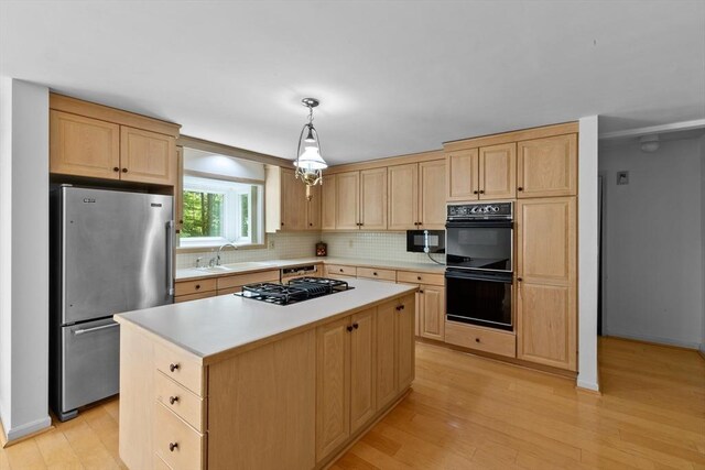 9 William Bradford Rd, Dartmouth, MA 02747 - kitchen featuring black appliances, light brown cabinets, a sink, light countertops, and light wood-type flooring