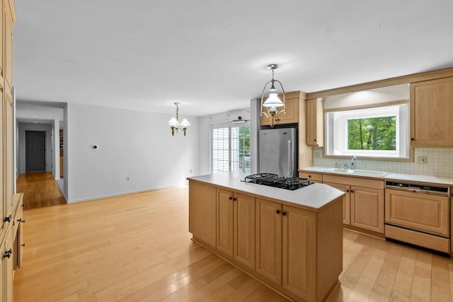 9 William Bradford Rd, Dartmouth, MA 02747 - kitchen featuring freestanding refrigerator, paneled dishwasher, black gas stovetop, a sink, and light countertops