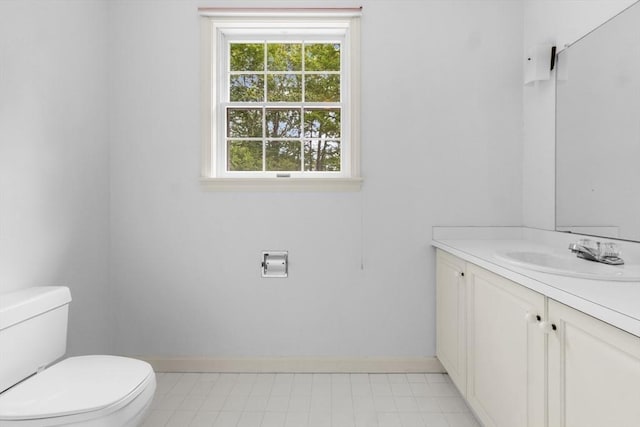 9 William Bradford Rd, Dartmouth, MA 02747 - bathroom with toilet, vanity, and baseboards