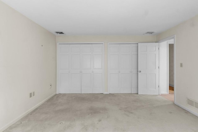 9 William Bradford Rd, Dartmouth, MA 02747 - unfurnished bedroom with two closets, light colored carpet, and baseboards