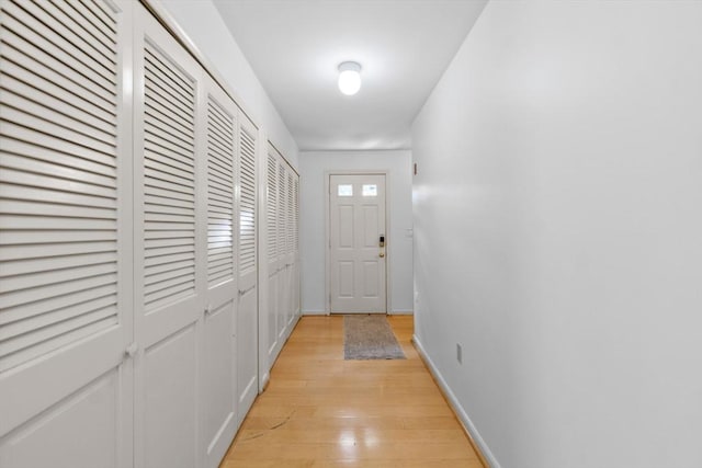 9 William Bradford Rd, Dartmouth, MA 02747 - doorway to outside with light wood finished floors and baseboards