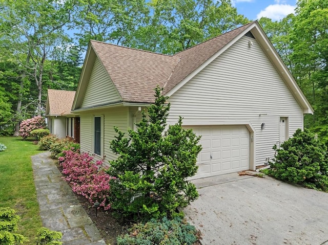 9 William Bradford Rd, Dartmouth, MA 02747 - view of property exterior featuring roof with shingles, driveway, and an attached garage