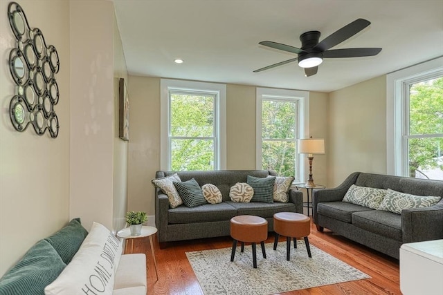 living area featuring wood finished floors, plenty of natural light, a ceiling fan, and recessed lighting