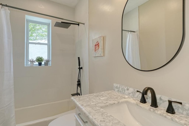 full bath featuring shower / bath combo, vanity, and toilet
