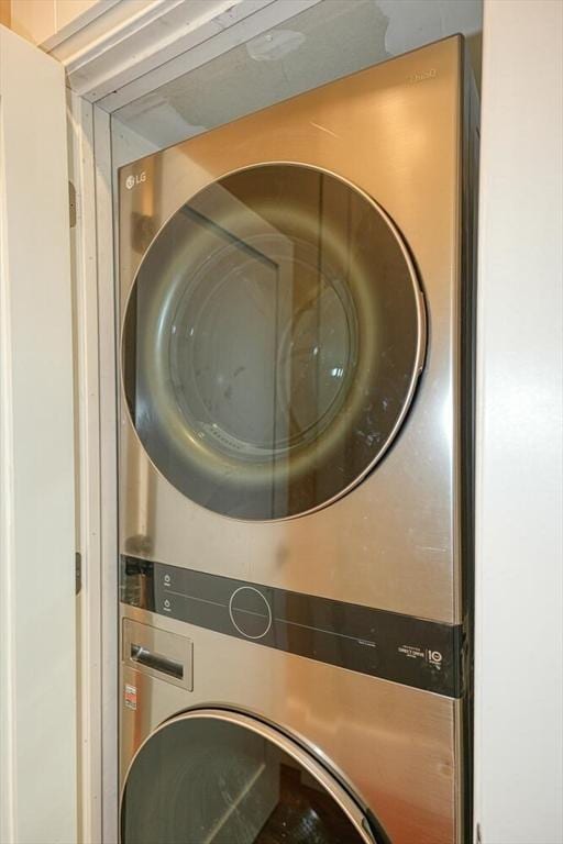 washroom with stacked washer / drying machine