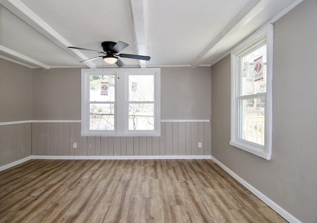 unfurnished room with ceiling fan and light wood-type flooring