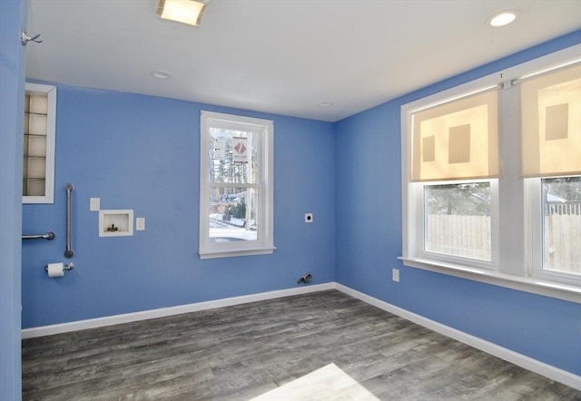 laundry area with dark hardwood / wood-style floors, hookup for an electric dryer, and hookup for a washing machine