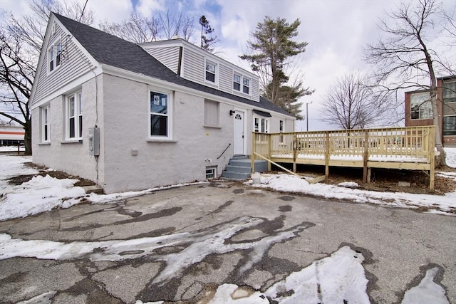 exterior space featuring a wooden deck