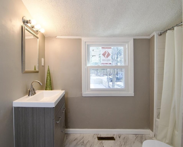 full bathroom with vanity, shower / bathtub combination with curtain, a textured ceiling, and toilet