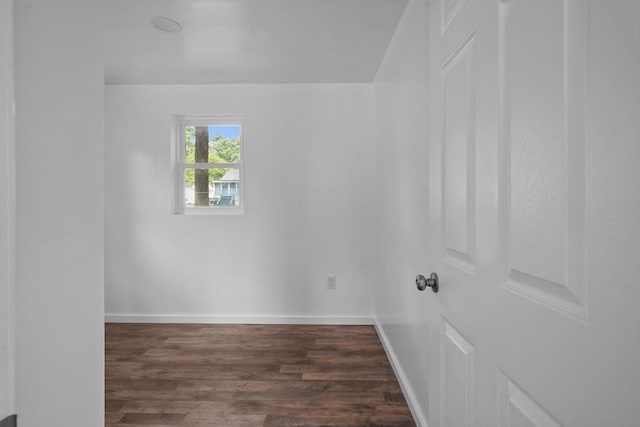 spare room featuring dark hardwood / wood-style flooring