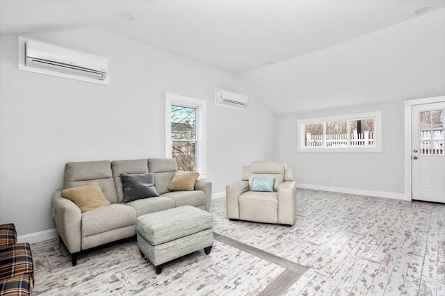 living room with a wall mounted air conditioner, lofted ceiling, and a wealth of natural light