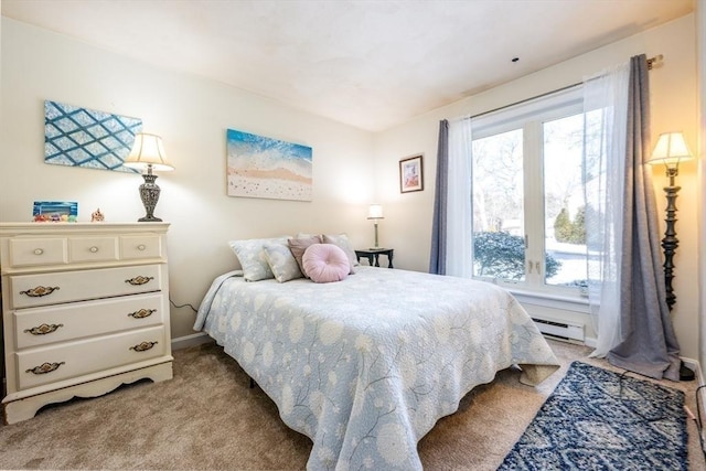 carpeted bedroom with a baseboard heating unit