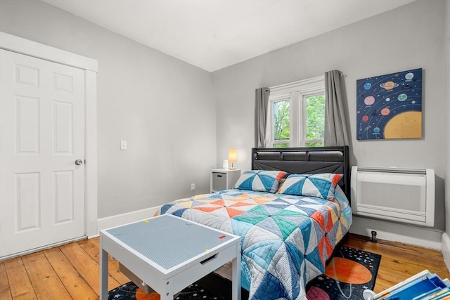 23 Schoolhouse Rd, Templeton, MA 01468 - bedroom featuring light wood-style floors, heating unit, and baseboards