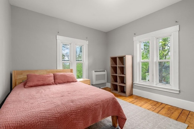 23 Schoolhouse Rd, Templeton, MA 01468 - bedroom with a wall mounted AC, multiple windows, wood finished floors, and baseboards