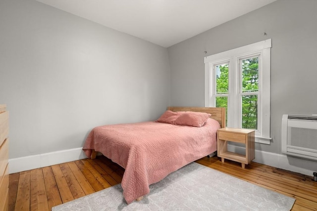 23 Schoolhouse Rd, Templeton, MA 01468 - bedroom with hardwood / wood-style floors, baseboards, and a wall mounted air conditioner