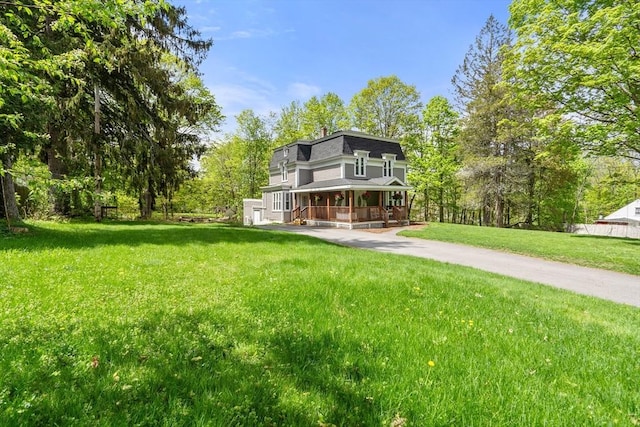 23 Schoolhouse Rd, Templeton, MA 01468 - view of front facade featuring covered porch and a front yard