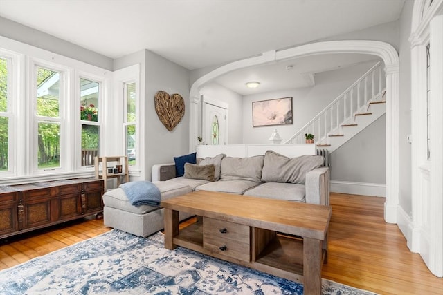 23 Schoolhouse Rd, Templeton, MA 01468 - living room with light wood-style floors, stairway, and baseboards