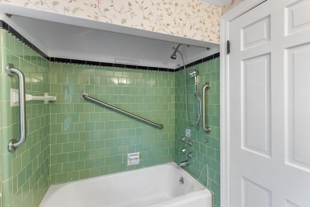 bathroom featuring wallpapered walls and bathing tub / shower combination