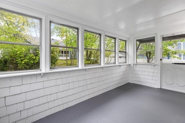 unfurnished sunroom featuring healthy amount of natural light