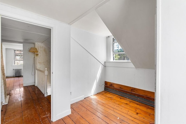 bonus room featuring hardwood / wood-style flooring and radiator