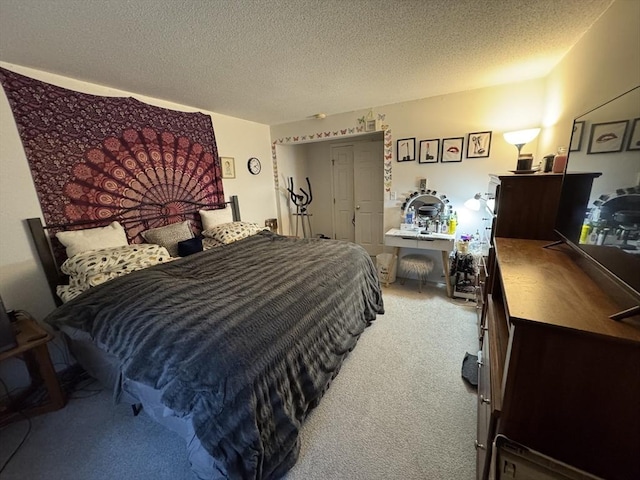 bedroom with carpet floors and a textured ceiling