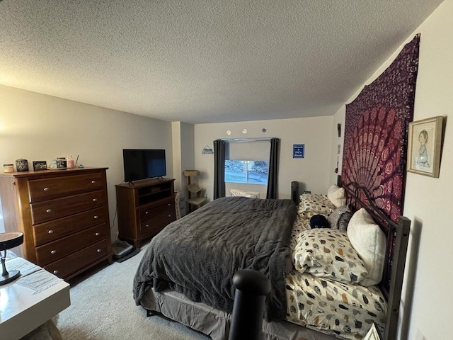 bedroom with carpet flooring and a textured ceiling