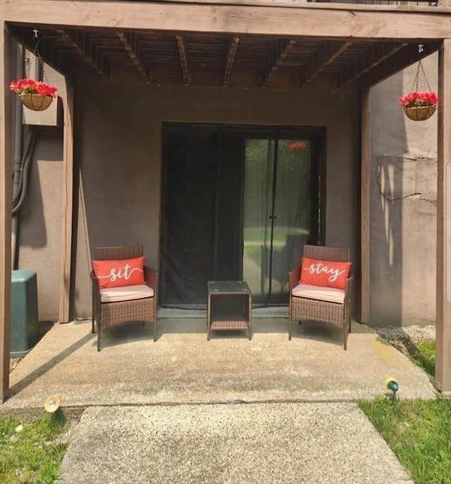 property entrance featuring a patio area