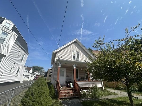 44 James St, Holyoke, MA 01040 - view of front facade featuring a porch and fence