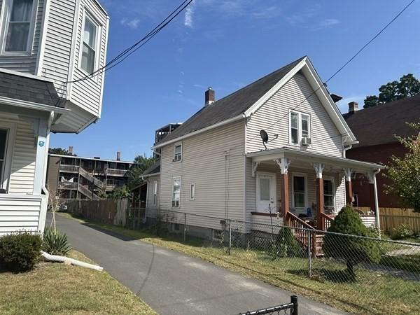 44 James St, Holyoke, MA 01040 - view of side of property with a porch and a fenced front yard