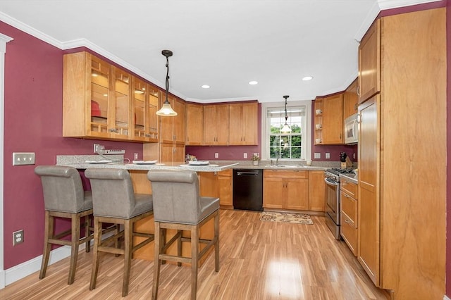 35 Warren Ave, Reading, MA 01867 - kitchen with stainless steel range with gas cooktop, white microwave, dishwasher, light wood finished floors, and ornamental molding