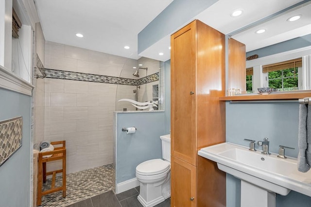 35 Warren Ave, Reading, MA 01867 - bathroom with walk in shower, toilet, a sink, recessed lighting, and tile patterned flooring