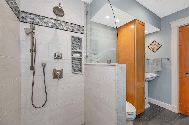 35 Warren Ave, Reading, MA 01867 - full bathroom featuring tiled shower and baseboards